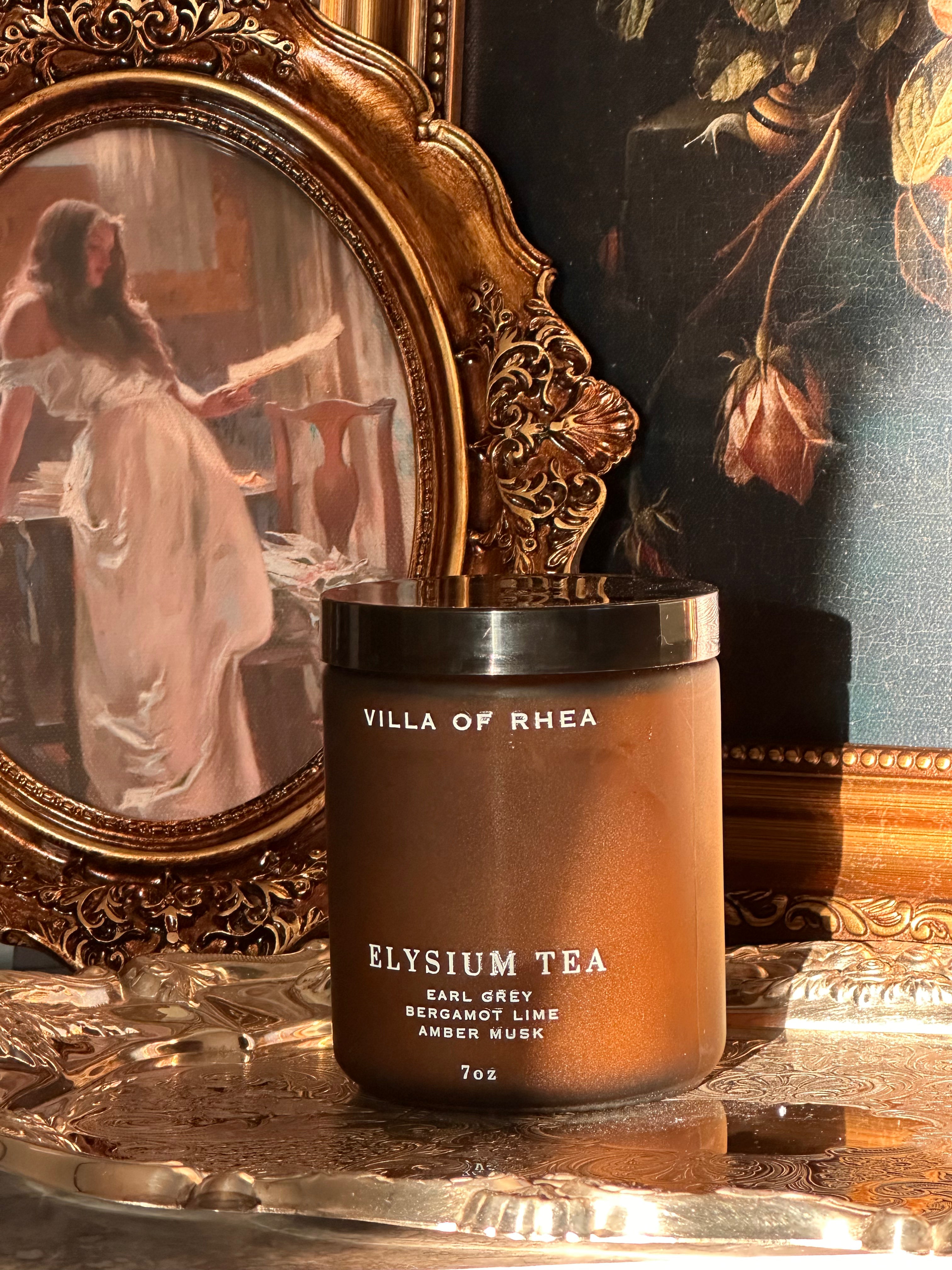 Villa of Rhea Elysium Tea candle on a reflective surface with decorative background. earl grey tea, bergamot lime, amber musk scent. Vintage style. greek mythology inspired. luxurious soy wax candies. renaissance art. 