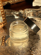 Jar of Villa of Rhea Aloe Vera lip balm on a decorative metal tray with a reflective background.Vintage style. Greek Mythology Inspired. Luxury lip balm. luxurious lip treatment